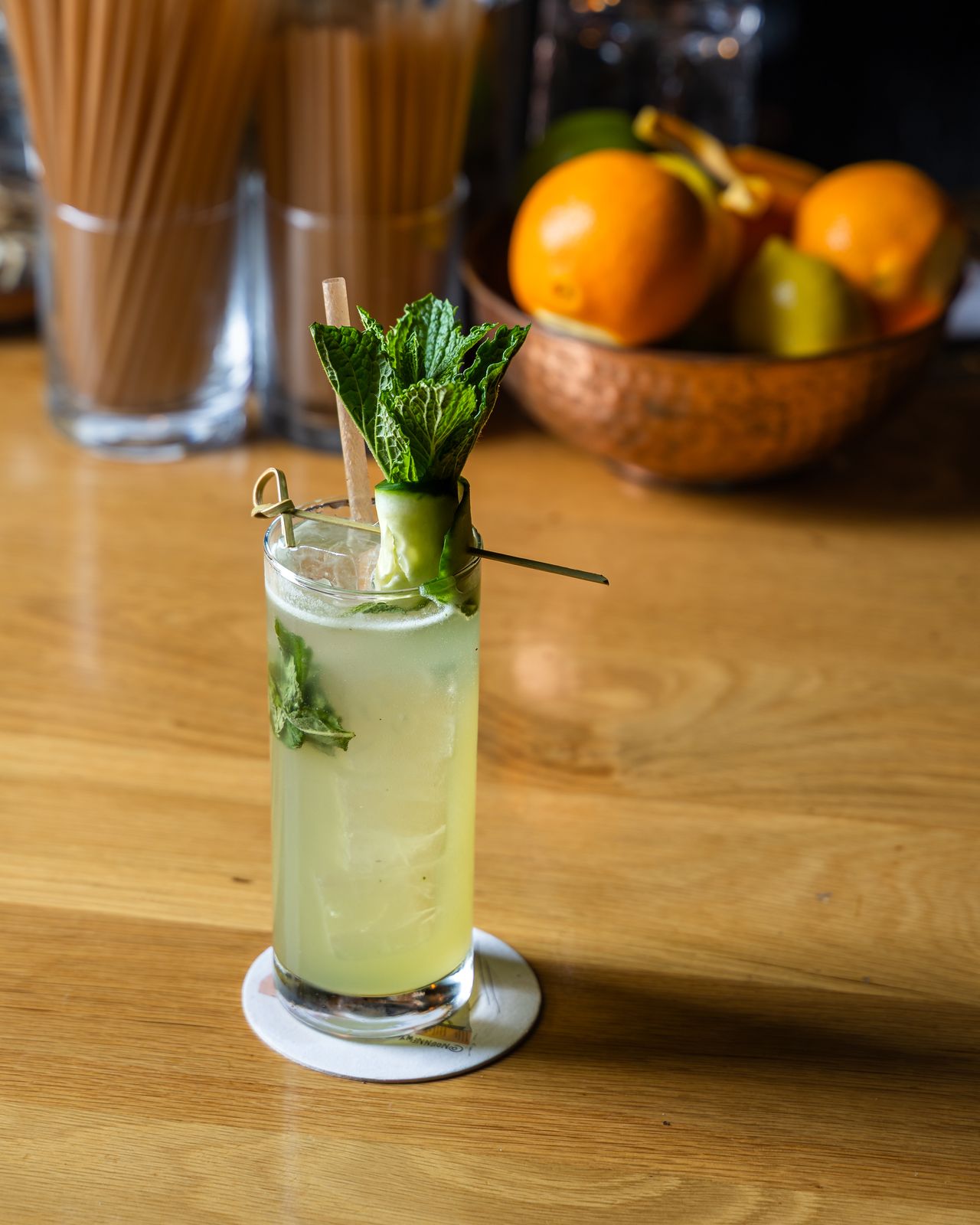 A handcrafted mint cocktail on the bar at Dear Maud